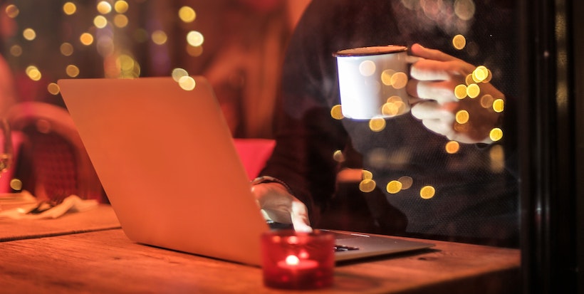 Man with coffee at night