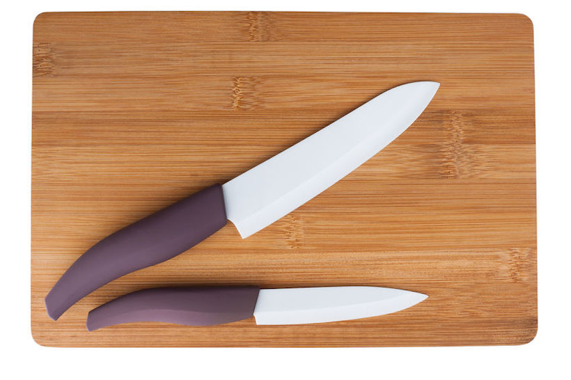 Two ceramic knife with a purple pen on cutting boardCeramic knives