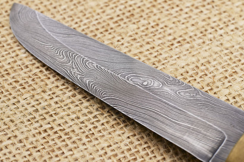 How is damascus steel made