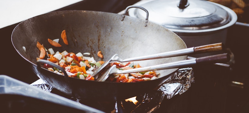 Frying veggies in a wok
