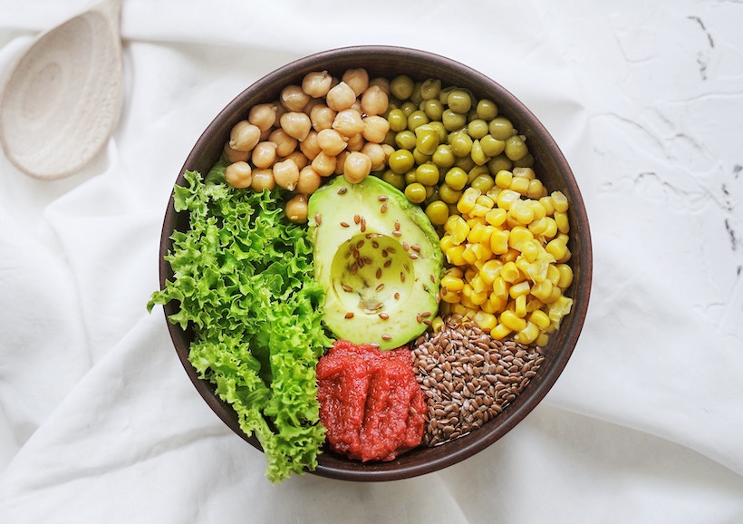 Healthy salad in a bowl on a white tablecloth