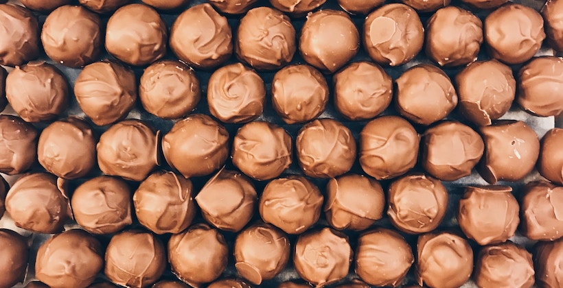 Milk chocolate balls in an array on a table