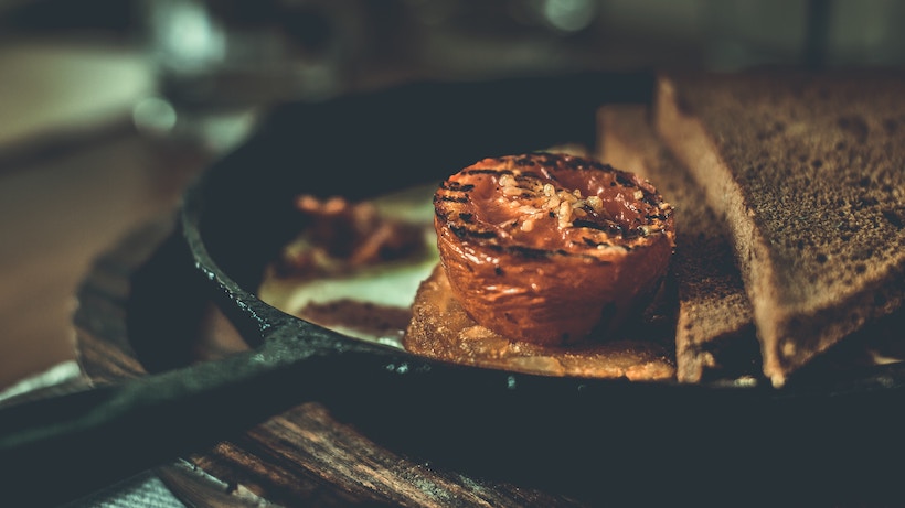 Sandwich being cooked on a cast iron pan