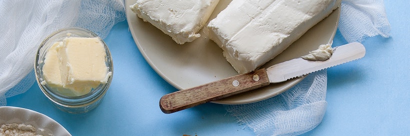Blocks and sliced butter with a butter knife