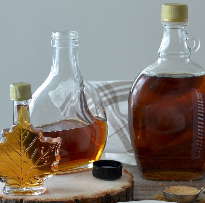 3 maple syrup bottles next to each other