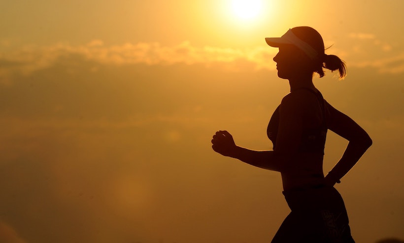 Woman jogging in the sunset