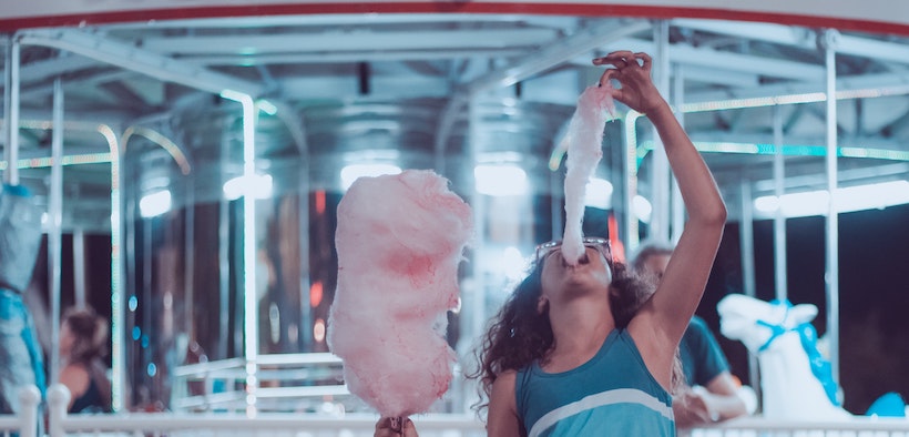 Woman eating cotton candy