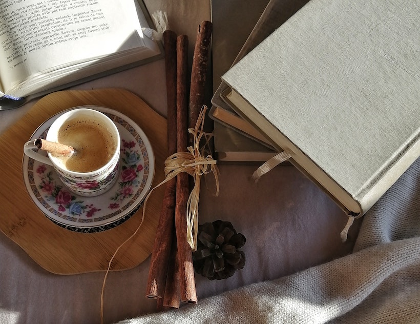 Chai tea next to some books