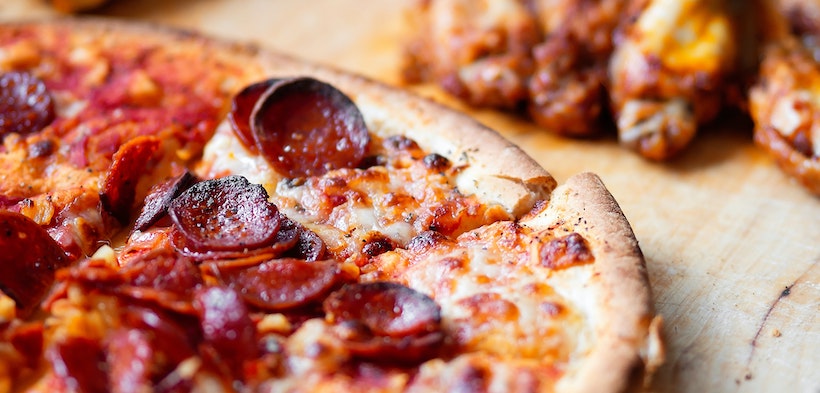 Angle shot blur of pepperoni pizza