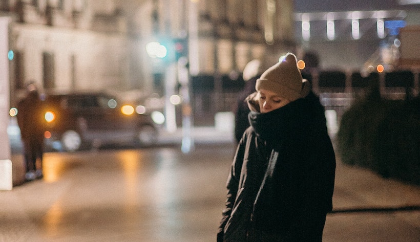 Late at night lady on streets looks tired can't sleep